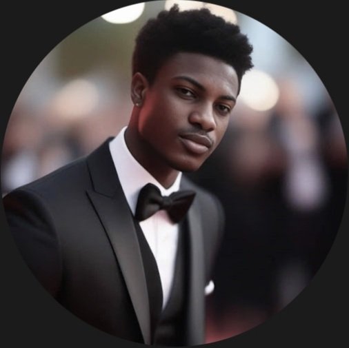 Nigerian man working on laptop and phone, founder or CEO profile