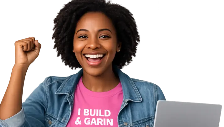 Smiling Nigerian entrepreneur using a laptop